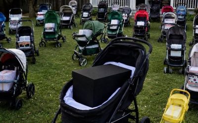 After Losing My Newborn Son, I Gave Everything I’d Bought Him to a Mother Begging with Her Baby – The Next Morning, My Lawn Was Covered with Dozens of Baby Strollers, Each Holding a Sealed Box